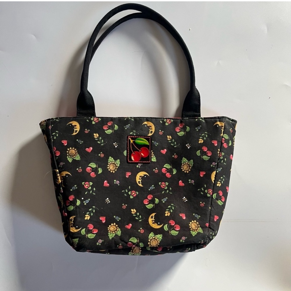 Mary Engelbreit cherry moon flowers, black purse with red Detail